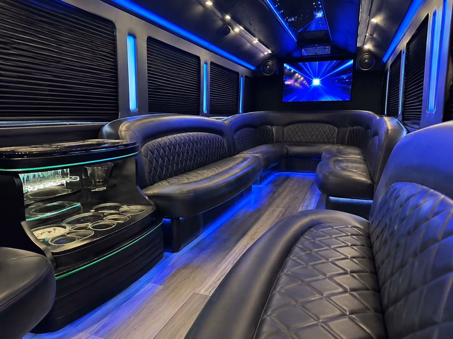 Wraparound seating inside a party bus rental serving Downey